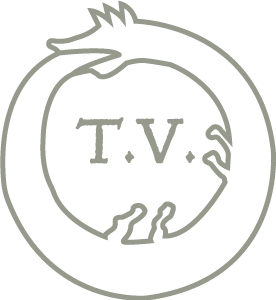A simplified symbol of an ouroboros with the initials T.V. in the center.